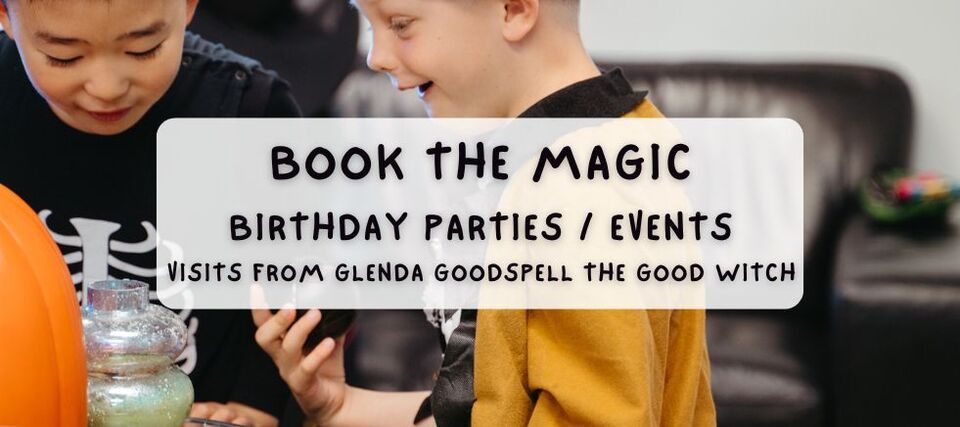 Two young children engaged in a magical-themed party activity, with text on the image that says, "Book the Magic: Birthday Parties / Events – Visits from Glenda Goodspell the Good Witch." The setting includes a pumpkin and jars, adding to the festive atmosphere.